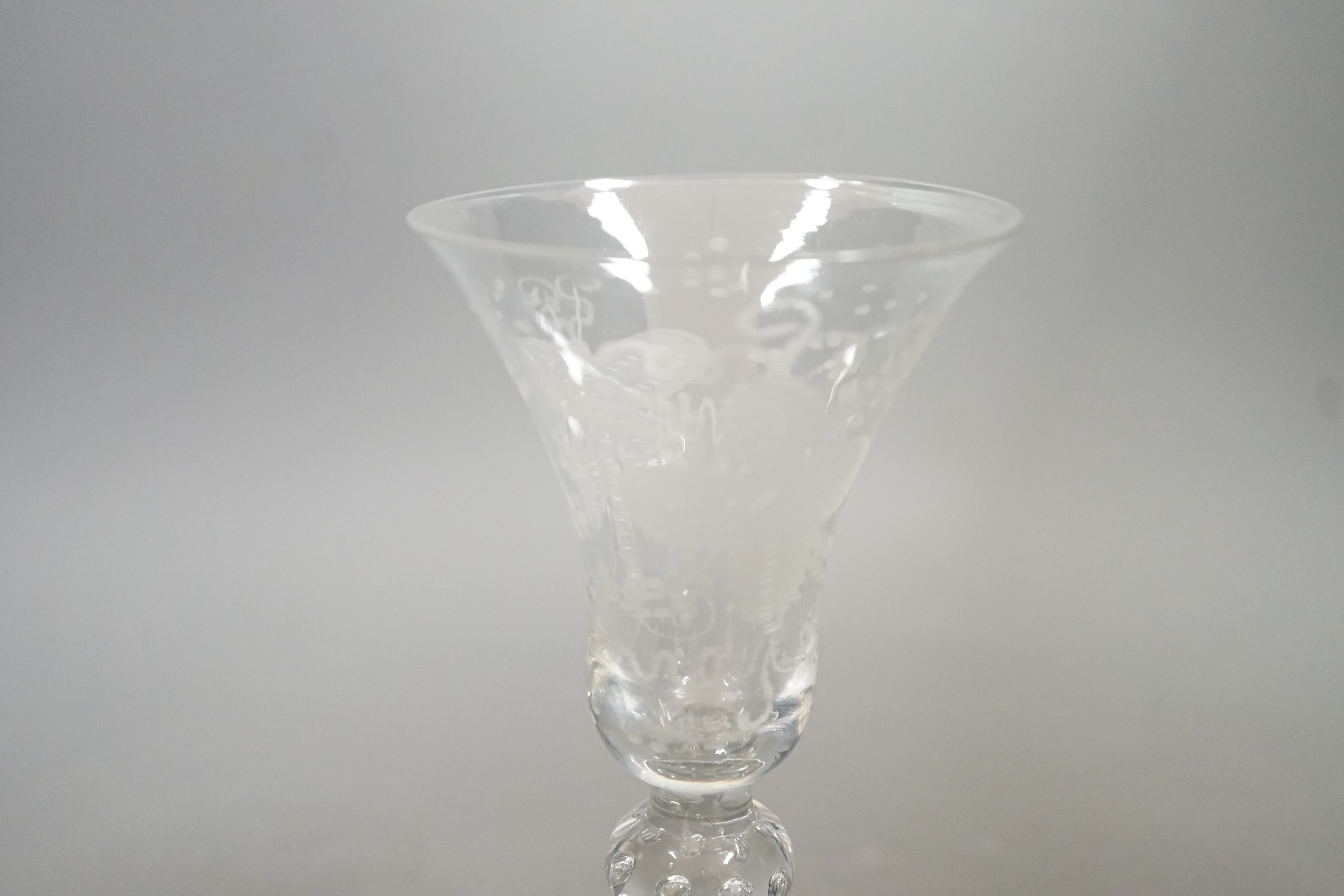 An 18th century Newcastle type baluster wine glass, 18cms high